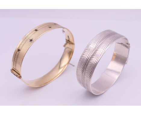 A silver bangle and another bangle. The former 6 cm diameter and 26.2 grammes.