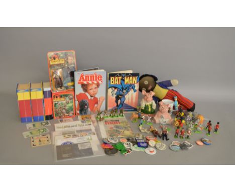 A mixed lot including three 'Harry Potter' hardback books, two Wade 'Natwest' Pig money boxes, a vintage Chad Valley 'Golly',