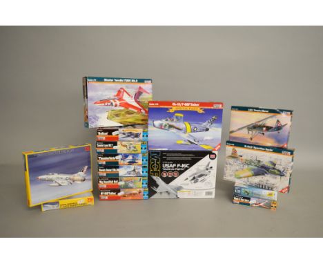 Fifteen plastic model kits, all 1:72 scale aircraft, by MisterCraft, PM Model and similar. Boxed, unstarted and complete.