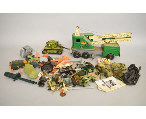 A mixed lot including Palitoy action man accessories including leaflets, clothes etc. Marx Pressed steel Powerhouse and a Mec