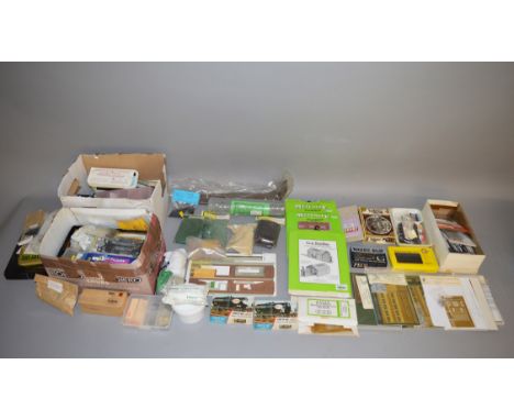 A quantity of railway related kits including cardboard buildings, plastic and brass kits together with a small quantity of la