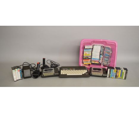A selection of vintage Gaming Equipment including an unboxed Commodore Plus 4 Console,  two Joysticks, sixty six games includ