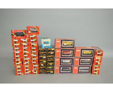 OO Gauge. A very good quantity of boxed Rolling Stock and Coaches including thrity six wagons and three coaches by Hornby, fo