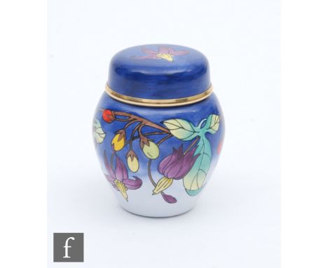 A Moorcroft Enamel ginger jar and cover decorated with hand painted flowers, printed mark, height 5cm. 