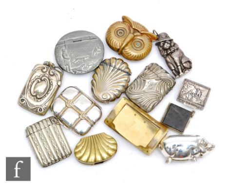 A collection of silver, plated and brass vesta cases to include novelty examples such as a modern silver pig, a poodle and a 