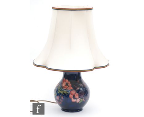 A Moorcroft Pottery lamp base decorated in the Anemone pattern, impressed mark, with later Moorcroft shade, height 27cm. 
