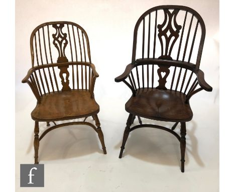 A 20th Century ask stick back Windsor elbow chair, on splayed legs and crinoline stretcher and a similar oak chair. (2) 