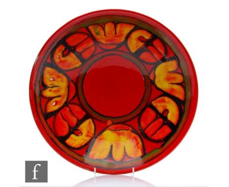 A large Poole Pottery Delphis shape 58 bowl decorated in tones of yellow, orange and red, printed mark, diameter 34cm. 