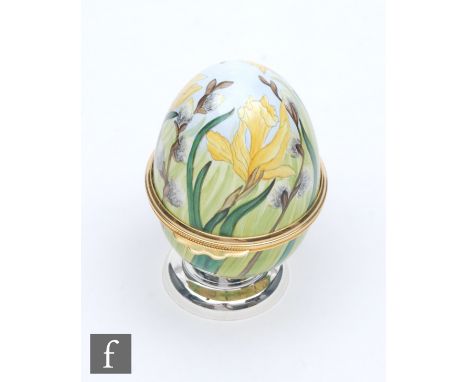 A Moorcroft Enamel egg shaped trinket box decorated with hand painted daffodils and pussy willow, printed mark, height 7cm. 