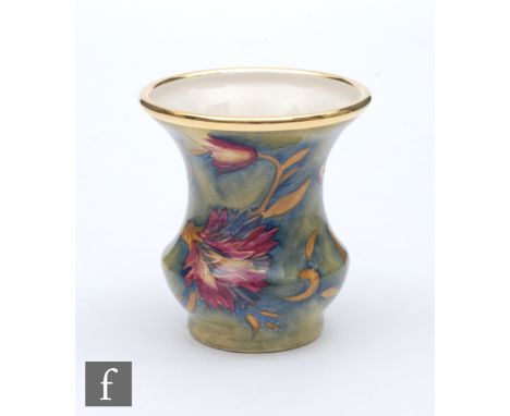 A boxed Moorcroft Enamel vase decorated in the Spanish pattern, printed mark, height 4.5cm. 