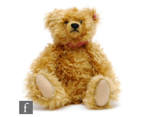 A Steiff 668395 Sound of Music, golden mohair, with porcelain tag, height 30cm, with dust bag. 