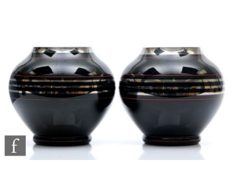 A pair of 1930s Czechoslovakian black glass vase by HEM, of shouldered ovoid form with everted rim, with bands of silver gilt