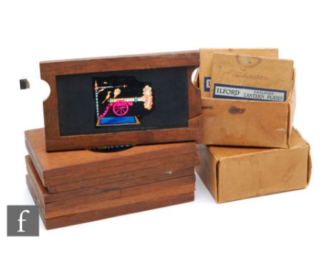 A collection of eight 19th Century mahogany cased magic lantern slides, various scenes and a small quantity of glass slides. 