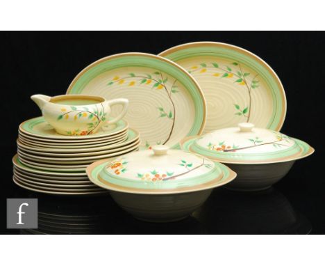 A Clarice Cliff Lynton shape dinner service in the Dryday pattern circa 1939, comprising two graduated serving plates, two tu