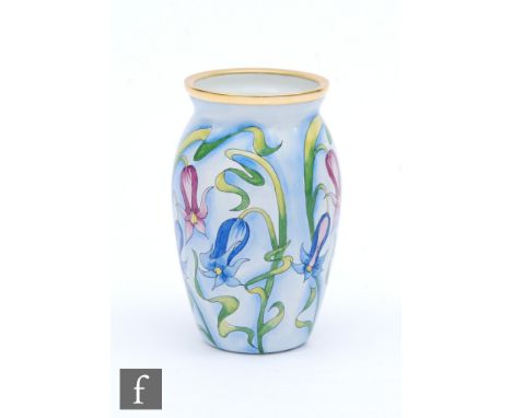 A Moorcroft Enamel vase decorated with hand painted purple and blue flowers,&nbsp;printed mark, height 6cm. 