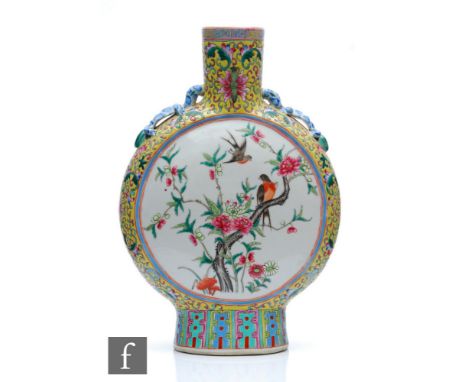 A Chinese yellow ground famille rose moonflask, the porcelain flask rising from a high foot and flanked by two opposing drago