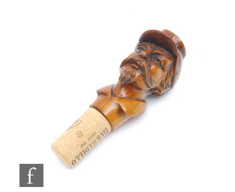 A late 19th Century carved walnut walking stick handle in the form of an American Confederate soldier, height 8.4cm and diame