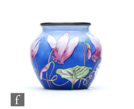 A Moorcroft Enamel vase decorated with hand painted purple flowers, printed mark, height 4.5cm. 