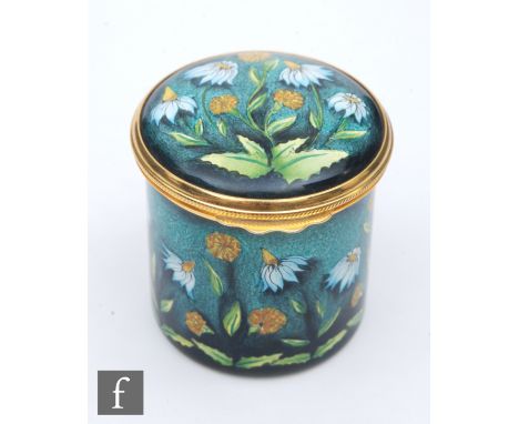 A Moorcroft Enamel cylindrical box and cover decorated with hand painted daisies, printed mark, height 4.5cm. 