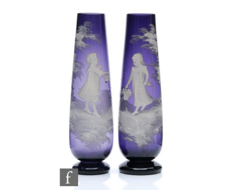A pair of late 19th Century Continental 'Mary Gregory' vases, the footed tapered sleeve form hand enamelled with children car