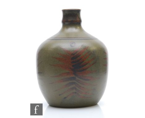 A studio pottery vase of slightly square form decorated with brown and black brushstroke leaves against an olive green ground