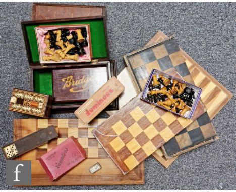 Three wooden chess boards, two complete boxwood chess sets, a Romanesque chess set, a Cribbage board set and other games. (qt