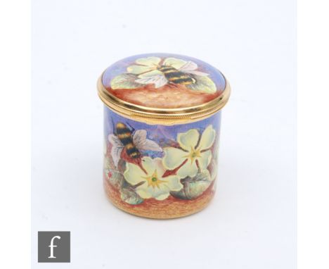 A Moorcroft Enamel cylindrical box and cover decorated with hand painted bumble bees and primula, printed mark, height 4.3cm.