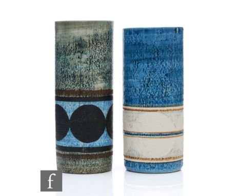 Two Troika Pottery cylinder vases, the first decorated by Penny Black with a banded pattern against a blue ground, painted Tr