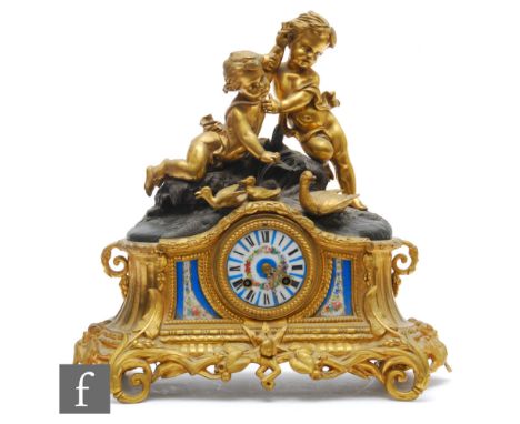 A late 19th Century French gilt mantle clock, the sevres style panel dial below a two amorini and three ducks on a pierced sc