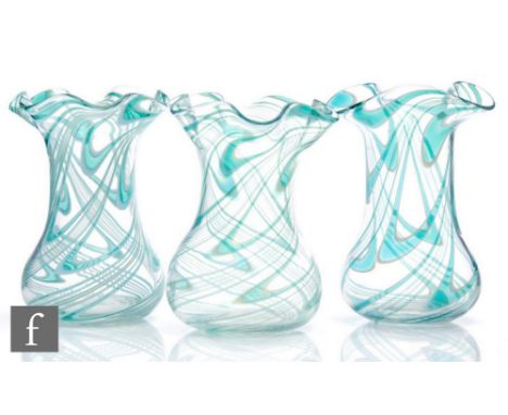 A trio of late 19th Century Thomas Webb &amp; Sons Filamentosa glass vases with everted frill rims, decorated with green and 