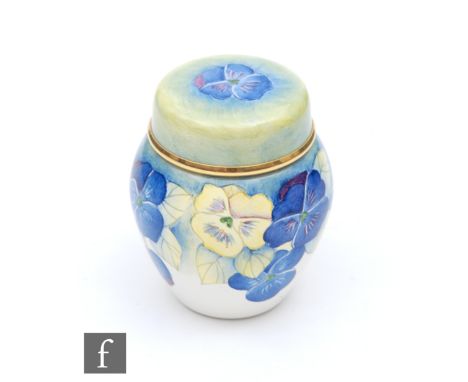 A boxed Moorcroft Enamel miniature ginger jar and cover decorated in the Pansy pattern, printed mark, height 5cm. 