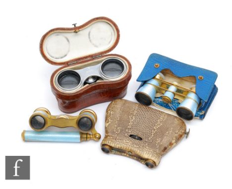 A pair of Busch opera glass with mauve guilloche enamel lenses, a similar pair in pale blue enamel and mother of pearl eye pi