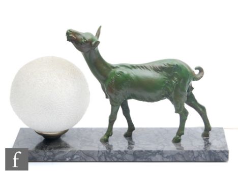 A 20th Century French table lamp, decorated with a green painted figure of a stylised fawn with flowers, frosted moulded sphe