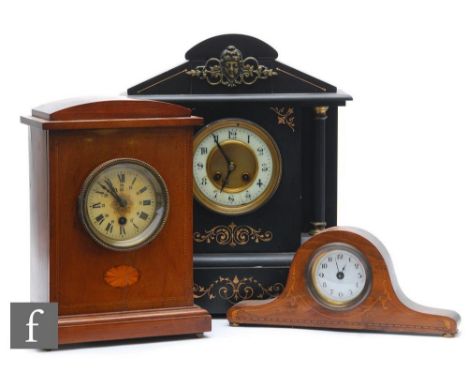 A Victorian black slate mantle clock, width 40cm, a small Edwardian inlaid mahogany mantle clock, height 28cm, and a small in