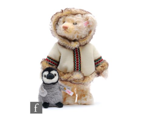 A Steiff 037139 Teddy Bear Eskimo with Penguin, mohair teddy bear with jacket, height 30cm, with alpaca penguin, limited edit