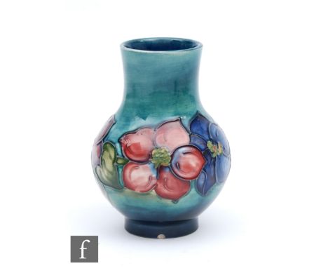 A Moorcroft Pottery vase decorated in the Anemone pattern, marks obscured by Potter to the late Queen Mary paper label, heigh