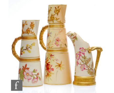 Two late 19th Century Royal Worcester blush ivory conical ewers each decorated with sprays of flowers with moulded bands and 