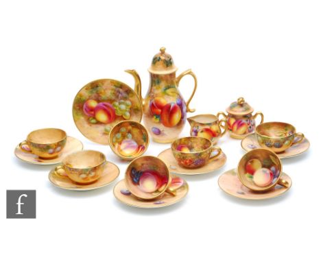 A Royal Worcester Fallen Fruits miniature coffee set comprising coffee pot, milk jug, sugar box and cover, lemon bowl, cake p