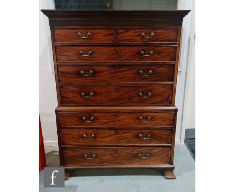 A George III mahogany chest on chest, with Greek key cornice and blind fret frieze above an arrangement of two short and six 