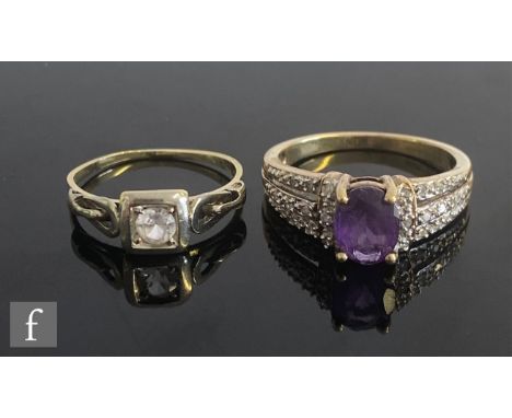 A 9ct hallmarked amethyst and diamond set ring, central oval amethyst to three row diamond set shoulders, weight 3g, with a s