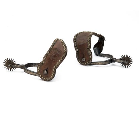 A RARE 'ROCKY MOUNTAIN' PAIR OF RIDING SPURS WITH STRAPS MARKED 'EATONS' RANCH' WOLF WYOMING, early 20th Century, with 1 1/2i