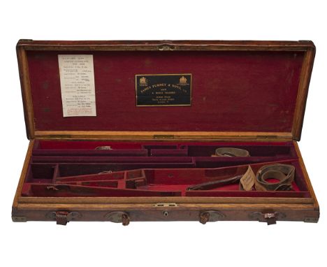 JAMES PURDEY & SONS A BRASS-CORNERED OAK AND LEATHER DOUBLE GUNCASE, fitted for 30in. barrels, the interior lined with red ba