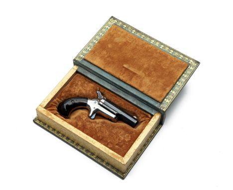 A .41 (RIMFIRE) COLT No3 THUER'S PATENT DERRINGER VEST PISTOL, no visible serial number, in a reproduction book casing, circa