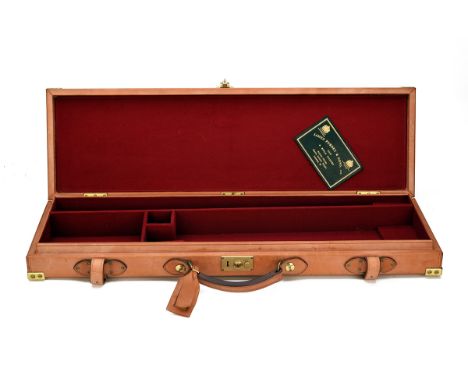 JAMES PURDEY &amp; SONS LTD A BRASS-CORNERED LEATHER SINGLE GUNCASE, fitted for 30in. barrels, the interior lined with red ba