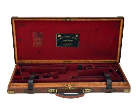 JAMES PURDEY &amp; SONS LTD A BRASS-CORNERED OAK AND LEATHER DOUBLE GUNCASE, fitted for 28in. barrels, the interior lined wit