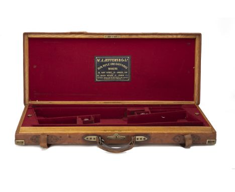 W.J. JEFFERY &amp; CO. LTD. A BRASS-CORNERED OAK AND LEATHER DOUBLE GUNCASE, fitted for 28in. barrels (could adapt to 30in.),