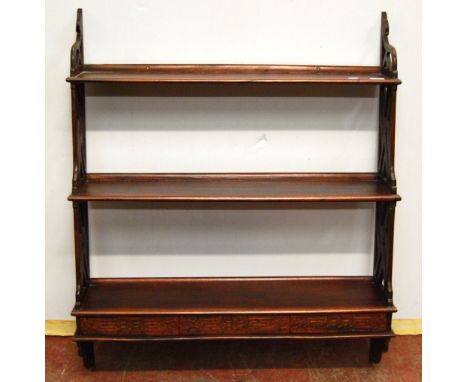 Victorian style mahogany three tier wall shelf, 74cm wide