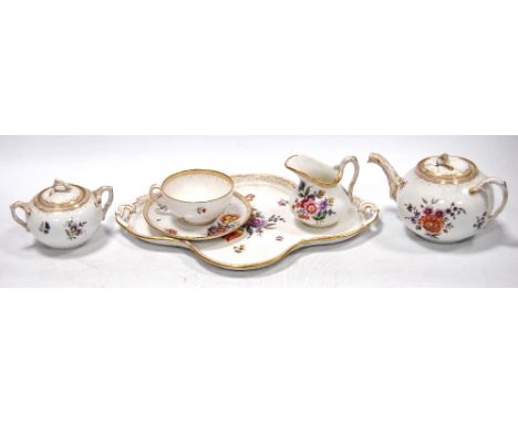 19th century Dresden porcelain solitaire tea service CONDITION REPORT: Jug, good condition.  Very slight wear to gilding on h