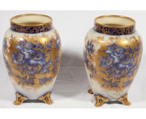 Pair of white ground Carltonware vases decorated with gilt and blue foliage, 23cm CONDITION REPORT: Scratches to body and min