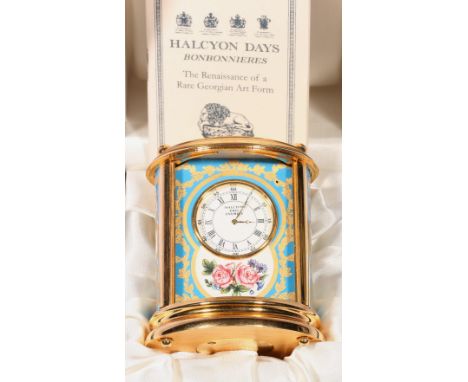 Halcyon Days enamel clock with turquoise and gilt decoration and floral panel, boxed, 10.5cm. CONDITION REPORT: The clock app